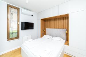 Postel nebo postele na pokoji v ubytování White Deluxe with terrace by OneApartments