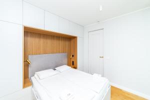 Posteľ alebo postele v izbe v ubytovaní White Deluxe with terrace by OneApartments