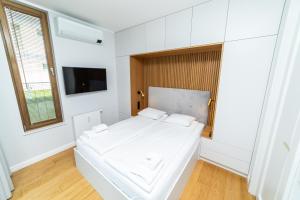 Posteľ alebo postele v izbe v ubytovaní White Deluxe with terrace by OneApartments