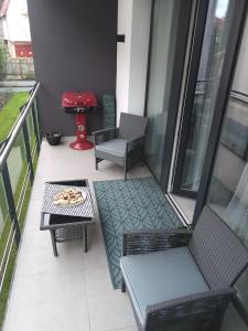 Posezení v ubytování Oasis Beach Apartman