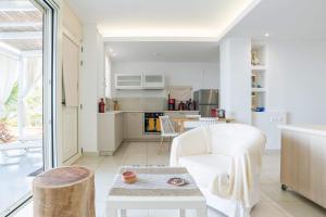 A kitchen or kitchenette at Junior suite by the beach Stalida