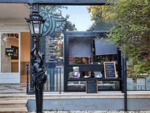 a street light in front of a store window at Estrada De Benfica 600 Apartamentos in Lisbon