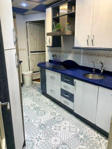 a kitchen with a sink and a toilet at Modern apartment with jacuzzi and city view, Almería, 80 m² in Almería