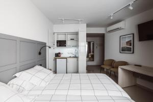 A kitchen or kitchenette at Exclusive Rooms in the Heart of the City