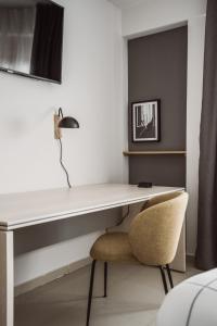 A television and/or entertainment centre at Exclusive Rooms in the Heart of the City