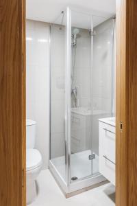 A bathroom at Exclusive Rooms in the Heart of the City