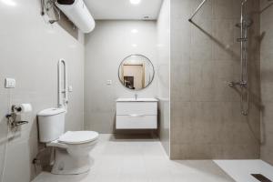 A bathroom at Exclusive Rooms in the Heart of the City