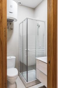 A bathroom at Exclusive Rooms in the Heart of the City