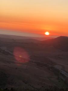 a sunset in the desert with the sun setting at Casas El Molino in Vejer de la Frontera