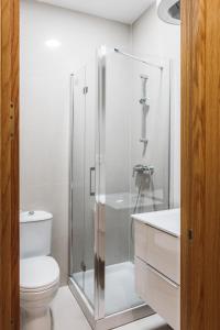 A bathroom at Exclusive Rooms in the Heart of the City