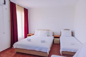 Postel nebo postele na pokoji v ubytování Apartmani Lasta