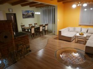 a living room with a couch and a table at 22 Kąty in Radziemice