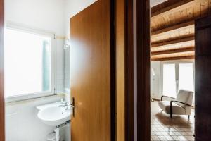a bathroom with a sink and a toilet and a mirror at In Centro Residenza - Suites & Apartments in Vasto +44 photos