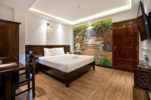 Postel nebo postele na pokoji v ubytování Lotus Laverne Hotel