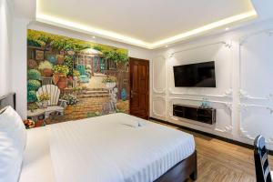 TV a/nebo společenská místnost v ubytování Lotus Laverne Hotel