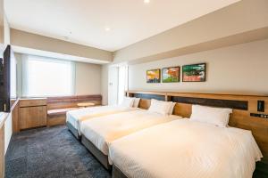 Hotel Forza Osaka Namba客房内的一张或多张床位