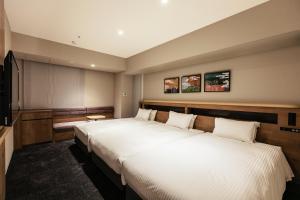 Hotel Forza Osaka Namba客房内的一张或多张床位