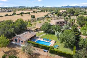 an aerial view of a house with a swimming pool at Finca Can Moleta in Cala Mendia