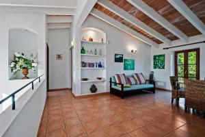 a living room with a couch and a table at Finca Vista Alegre in Cala Mendia