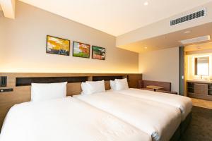 Hotel Forza Osaka Namba客房内的一张或多张床位