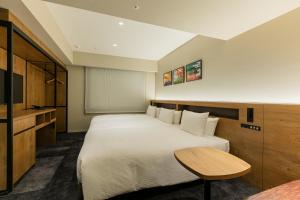 Hotel Forza Osaka Namba客房内的一张或多张床位