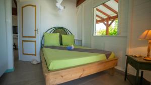 Ένα ή περισσότερα κρεβάτια σε δωμάτιο στο KALINAGO - Les Villas KIKKO