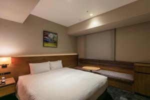 Hotel Forza Osaka Namba客房内的一张或多张床位