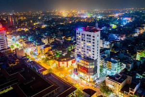 an aerial view of a city at night at SOJO Hotel Nam Dinh in Nam Ðịnh