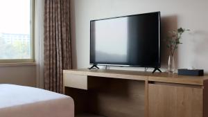 TV a/nebo společenská místnost v ubytování Bloom Hotel