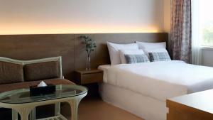 Postel nebo postele na pokoji v ubytování Bloom Hotel