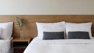 Postel nebo postele na pokoji v ubytování Bloom Hotel