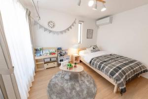 Postel nebo postele na pokoji v ubytování Sky Tree house