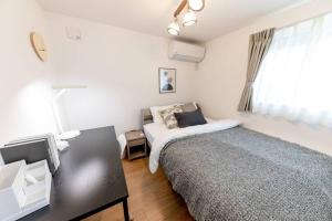 Postel nebo postele na pokoji v ubytování Sky Tree house