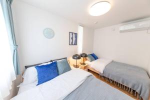 Postel nebo postele na pokoji v ubytování Sky Tree house