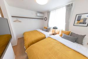 Postel nebo postele na pokoji v ubytování Sky Tree house