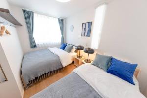 Postel nebo postele na pokoji v ubytování Sky Tree house