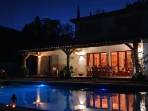 a house with a swimming pool at night at VIlla in Bargemon with Private Swimming Pool in Bargemon