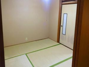 Postel nebo postele na pokoji v ubytování Imazato Ryokan