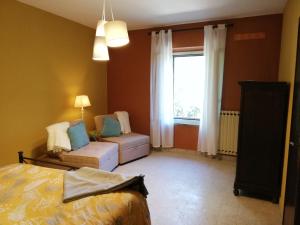 A bed or beds in a room at Casa Bellocchio