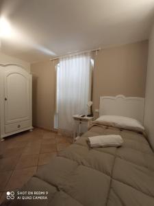 Posteľ alebo postele v izbe v ubytovaní B&B La Porta Vecchia