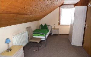 a small room with a bed and a window at Nice Home In Wasungen With Wifi in Wasungen