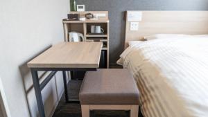 Postel nebo postele na pokoji v ubytování Super Hotel Kanku Kumatoriekimae + 37 fotografií