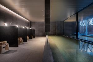 a hallway with a row of benches in a building at Sansui Niseko in Kutchan