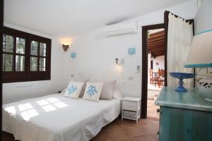 Posteľ alebo postele v izbe v ubytovaní Villa con discesa privata a mare + 37 fotografií