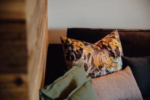 a pillow sitting on top of a couch at Zillertal Juwel in Fügen