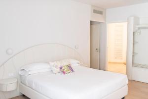 Postel nebo postele na pokoji v ubytování Aromi Piccolo Hotel