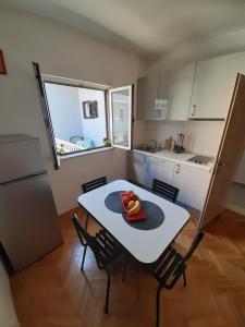 Kuchyň nebo kuchyňský kout v ubytování Apartment Luce
