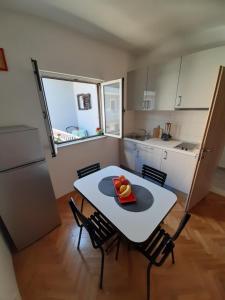 Kuchyň nebo kuchyňský kout v ubytování Apartment Luce