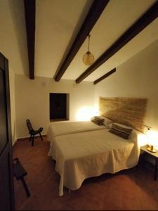 A bed or beds in a room at El Barranquillo