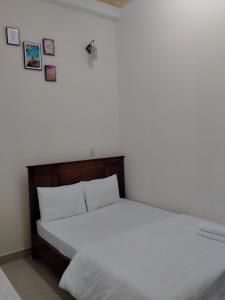 Postel nebo postele na pokoji v ubytování Minh Toàn Homestay